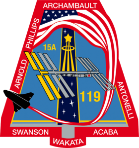 The shape of the STS-119/15A patch comes from the shape of a solar array viewed at an angle. The International Space Station (ISS), which is the destination of the mission, is placed accordingly in the center of the patch just below the gold astronaut symbol. The gold solar array of the ISS highlights the main cargo and task of STS-119/15A -- the installation of the S6 truss segment and deployment of S6's solar arrays, the last to be delivered to the ISS. The surnames of the crew members are denoted on the outer band of the patch. The 17 white stars on the patch represent, in the crew's words, "the enormous sacrifice the crews of Apollo 1, Challenger, and Columbia have given to our space program." The U.S. flag flowing into the space shuttle signifies the support the people of the United States have given our space program over the years, along with pride the U.S. astronauts have in representing the United States on this mission.