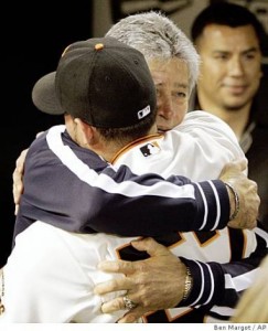 San Francisco Giants' Jonathan Sanchez, left, is embraced by his father, Sigfredo Sanchez, at the end of a baseball game after pitching a no-hitter against the San Diego Padres Friday, July 10, 2009, in San Francisco. Sanchez said his father arrived in San Francisco the previous night. "This is the first time he has seen me pitch. This is a gift for him," said Sanchez, "I feel awesome." (AP Photo/Ben Margot) Photo: Ben Margot, AP 